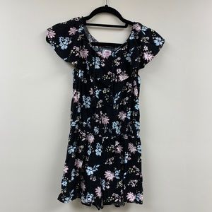 black romper with pastel floral details